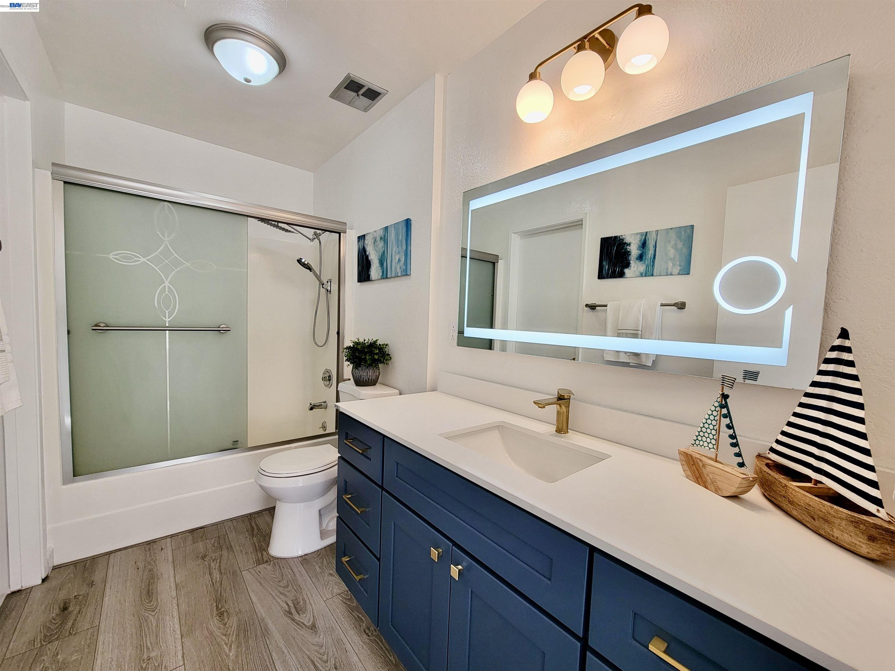 304 Hackamore Lane Fremont, CA 94539 - Photo 20 of 45 a bathroom with a sink a toilet and shower