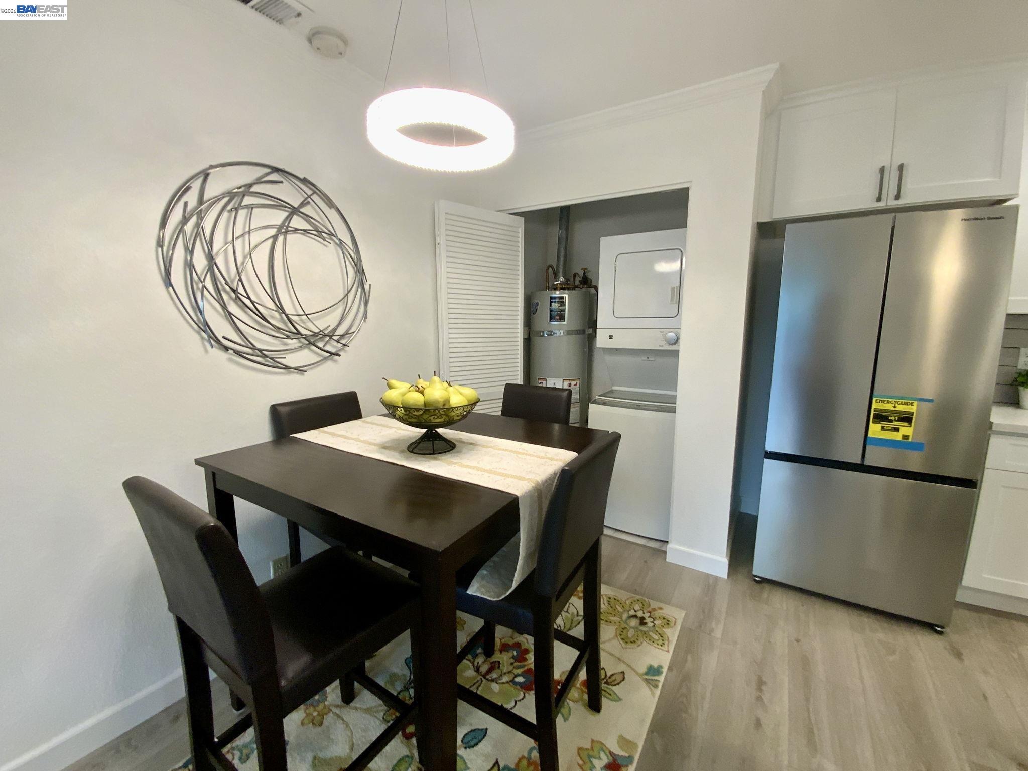 304 Hackamore Lane Fremont, CA 94539 - Photo 10 of 45 a view of a dining room with furniture and a refrigerator