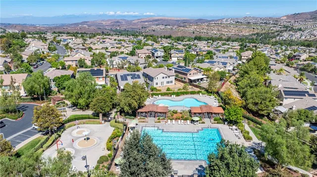 an aerial view of residential houses and outdoor space