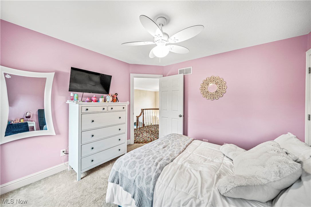 1879 Middleton Road Hudson, OH 44236 - Photo 31 of 50 Carpeted bedroom with ceiling fan