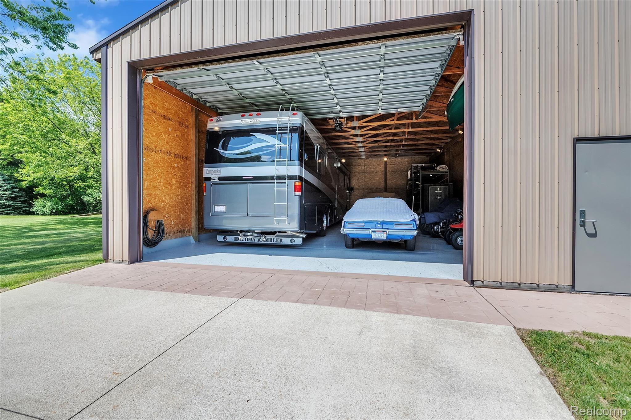4054 Bennett Lake Road Fenton, MI 48430 - Photo 35 of 57 Steel Security Entrance Door, Finished Walls, High Intensity Lighting, Exterior Floodlights, Water & 100 Amp & 220/110 Volt VAC Service