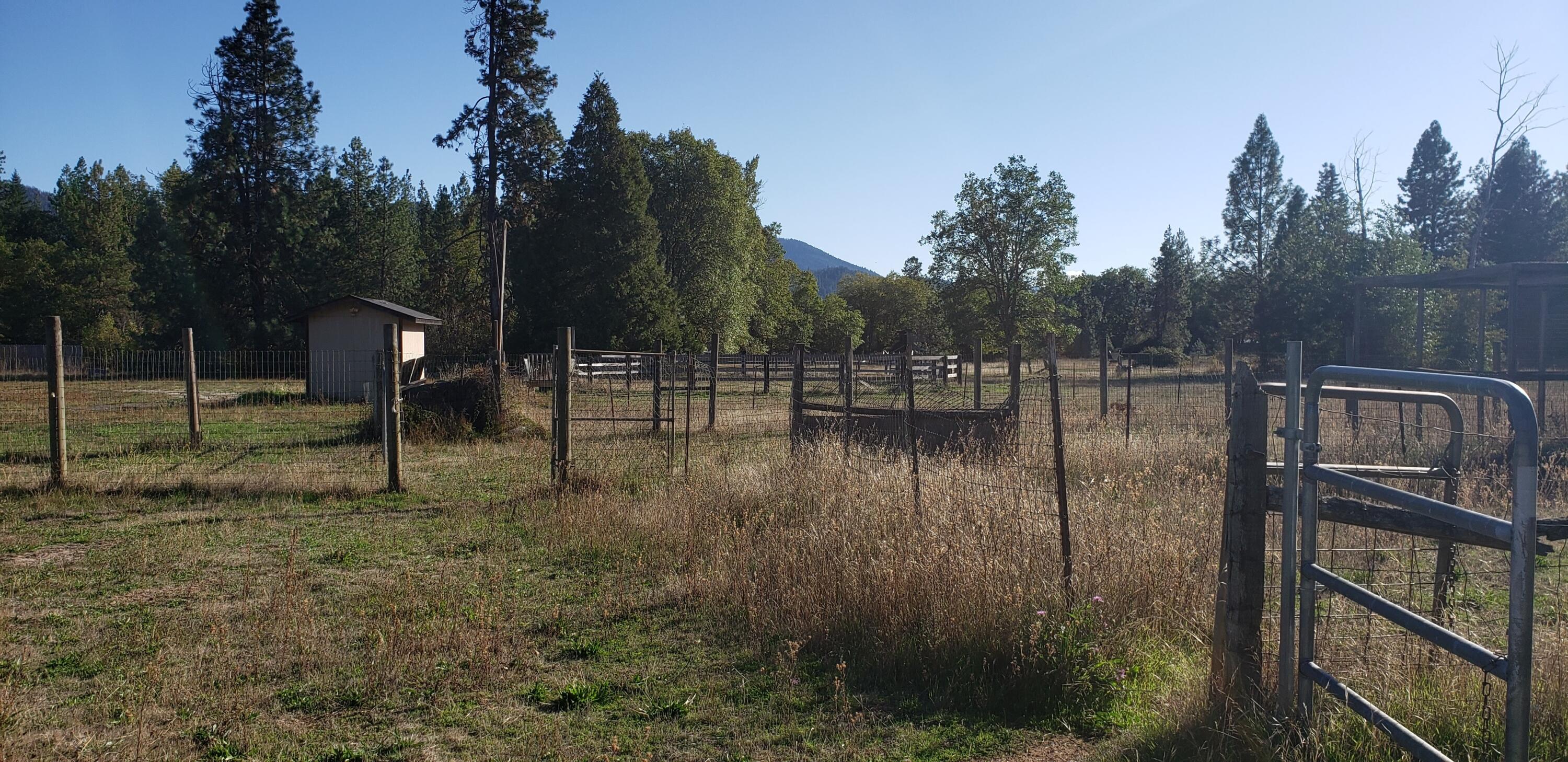 5565 Holland Loop Road Cave Junction, OR 97523 - Photo 16 of 19 Round pen thru gate on right, more pasture area.