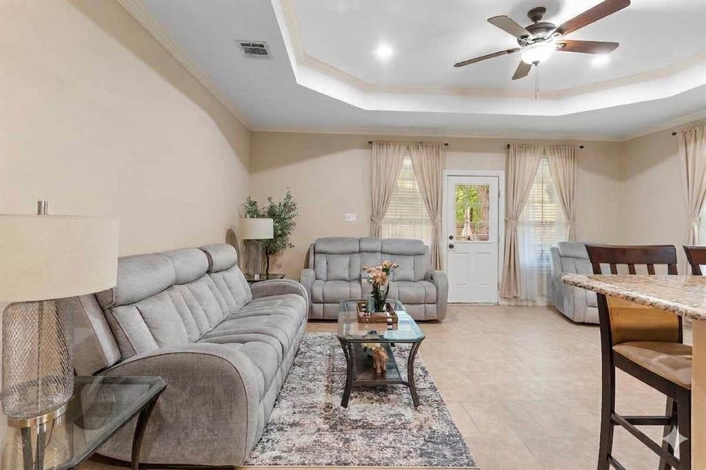 502 Ritchey Street Gainesville, TX 76240 - Photo 15 of 29 Tray ceiling with recessed lighting and crown molding