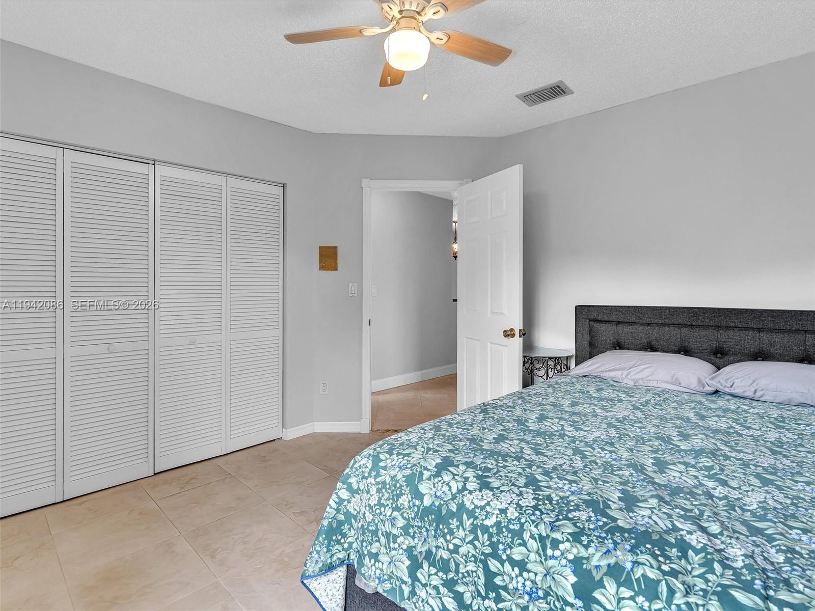 14824 Southwest 112th Street Miami, FL 33196 - Photo 34 of 56 Bedroom #3 Bedroom #3 looks onto the pool and the lake