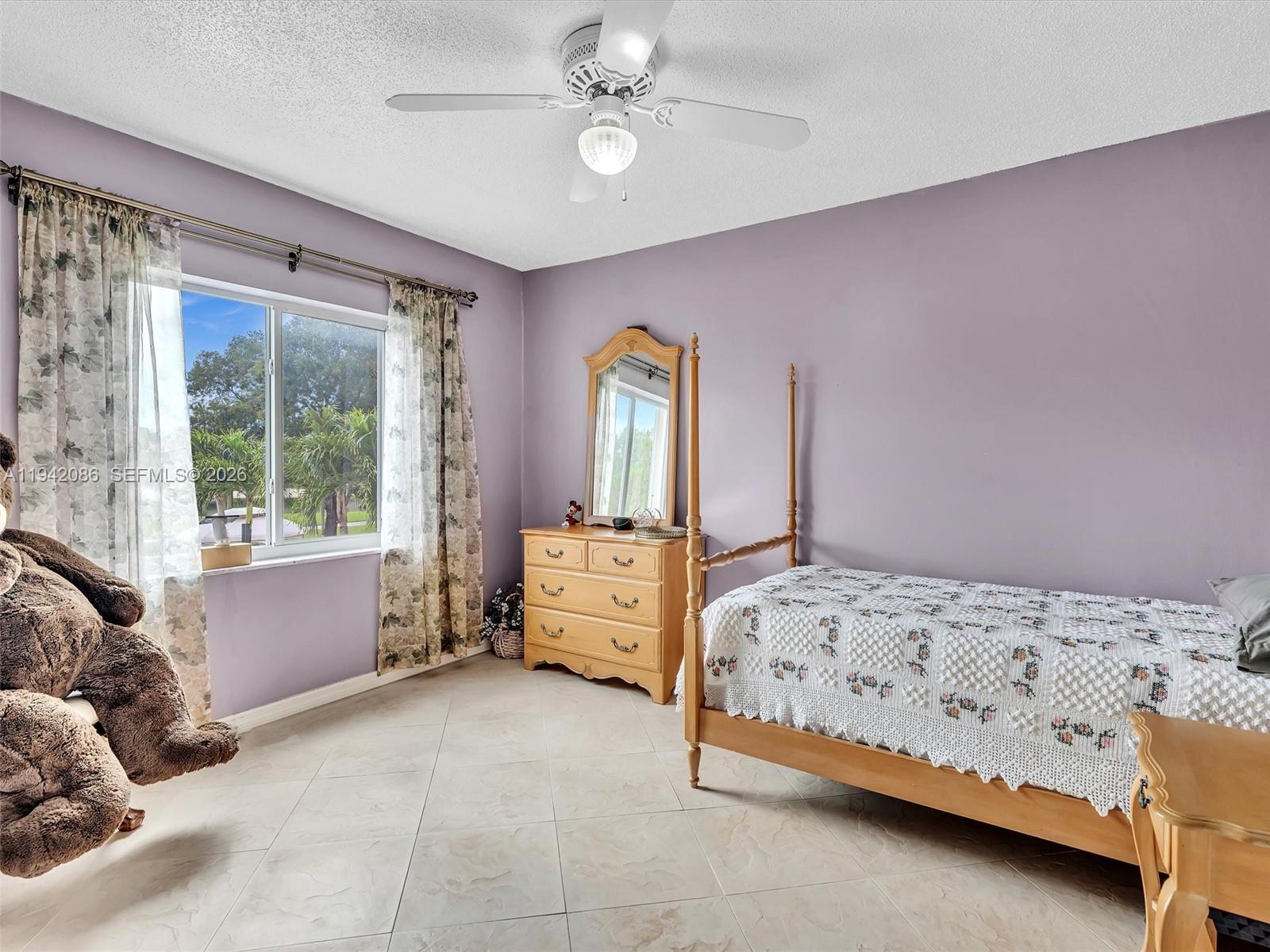 14824 Southwest 112th Street Miami, FL 33196 - Photo 35 of 56 Bedroom #4 looks onto the pool and the lake