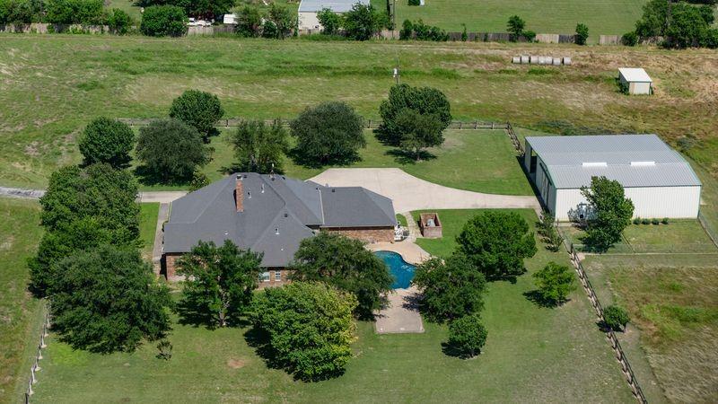 334 Farm To Market Road 2264 Decatur, TX 76234 - Photo 4 of 40 an aerial view of a house with a yard and lake view