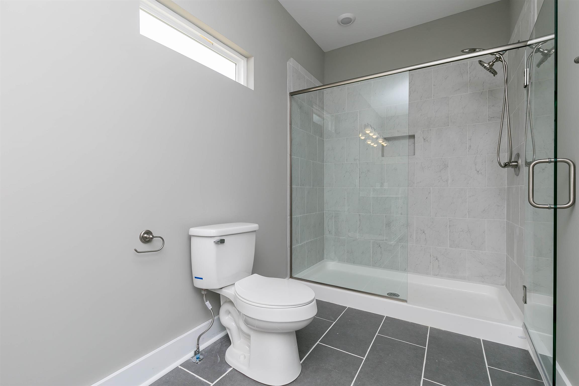 186 Fieldstone Lane Springfield, TN 37172 - Photo 15 of 22 a bathroom with a toilet and shower