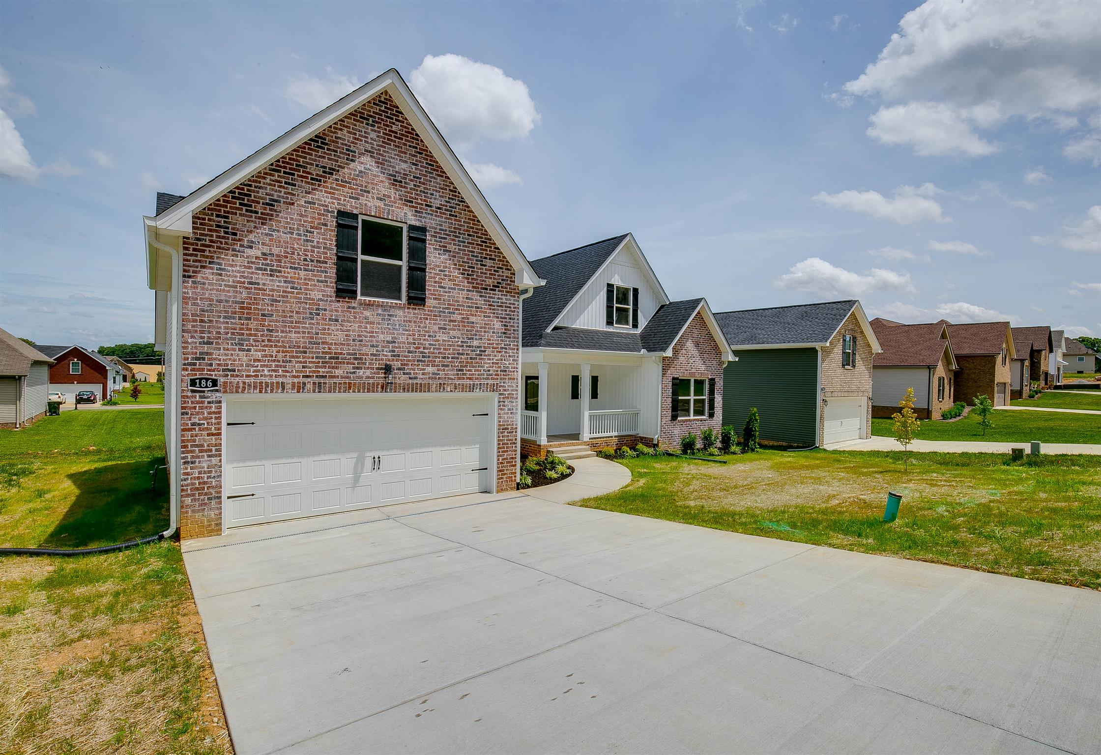186 Fieldstone Lane Springfield, TN 37172 - Photo 2 of 22 a front view of a house with a yard and garage