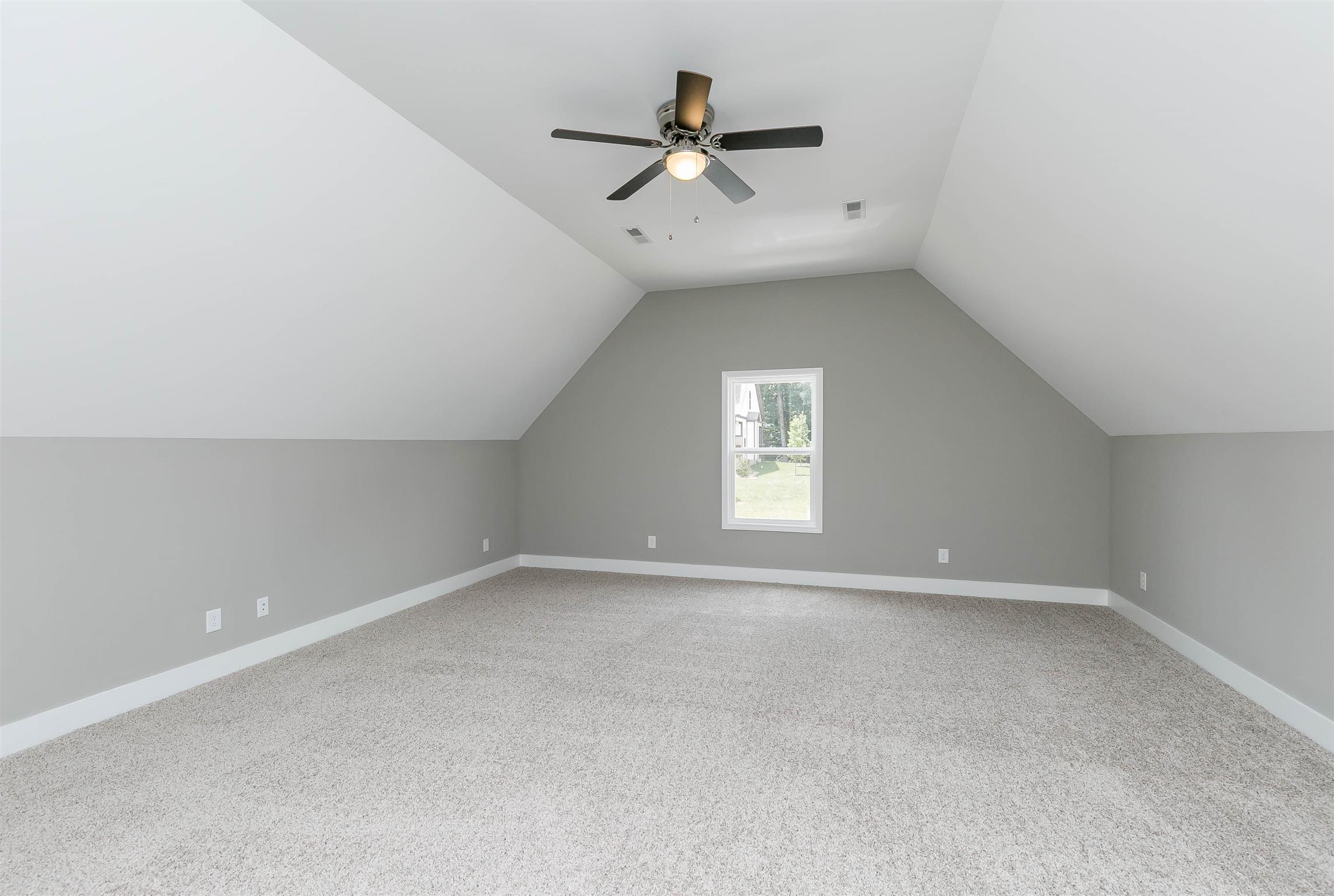 186 Fieldstone Lane Springfield, TN 37172 - Photo 21 of 22 an empty room with a window and a ceiling fan