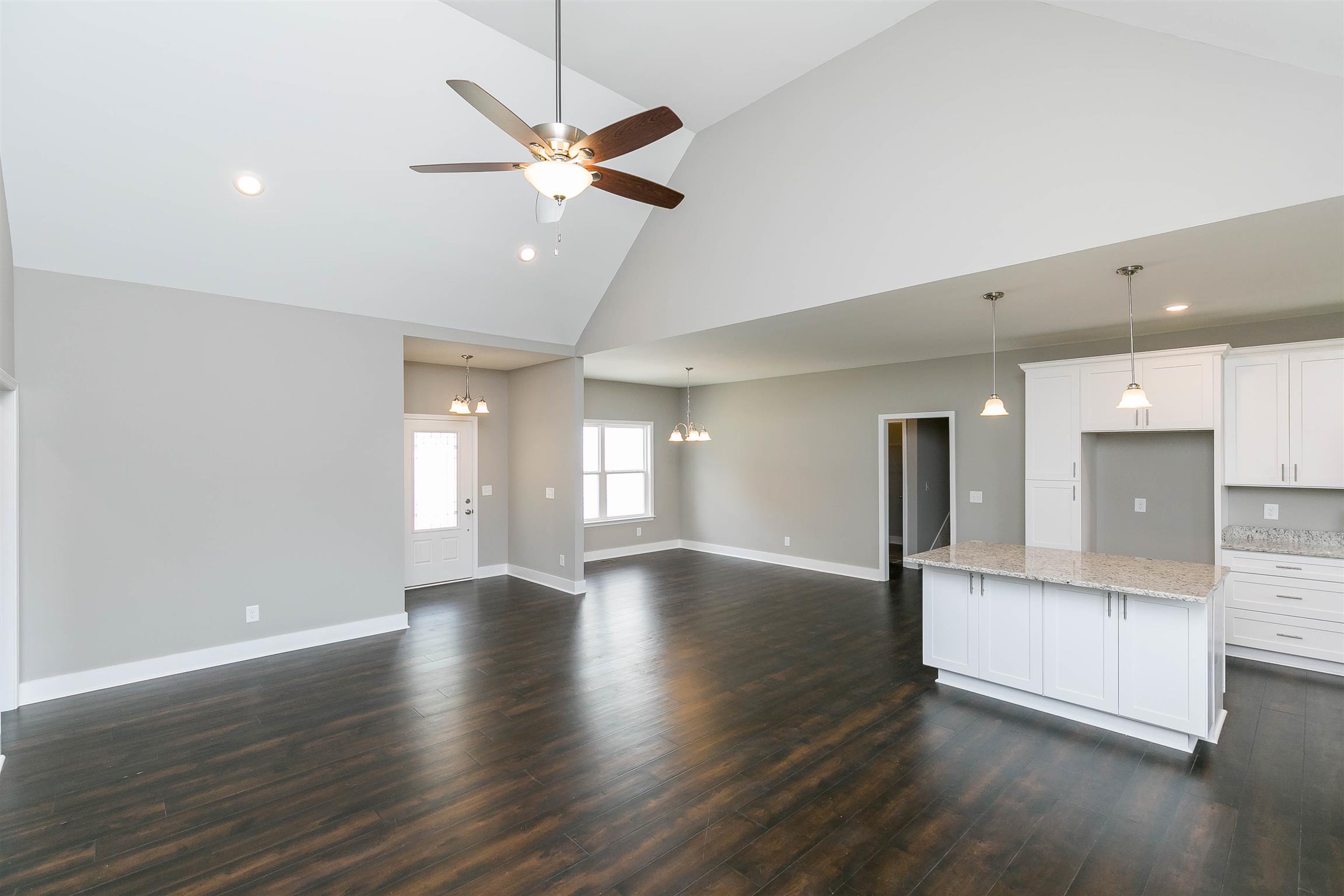 186 Fieldstone Lane Springfield, TN 37172 - Photo 5 of 22 a view of an empty room with wooden floor and a window