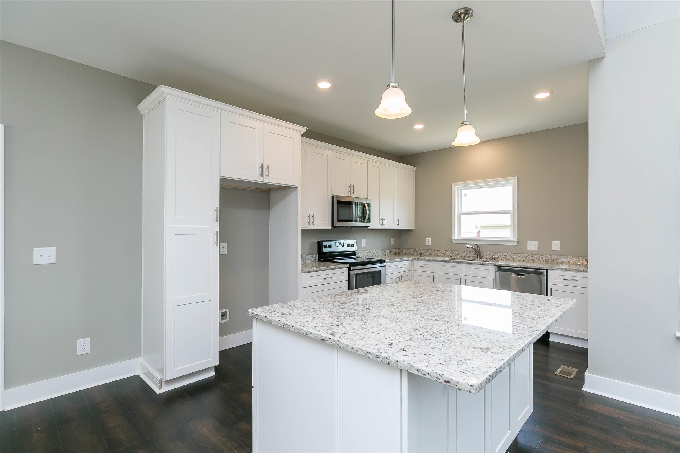 186 Fieldstone Lane Springfield, TN 37172 - Photo 10 of 22 a kitchen with stainless steel appliances granite countertop a sink refrigerator and cabinets
