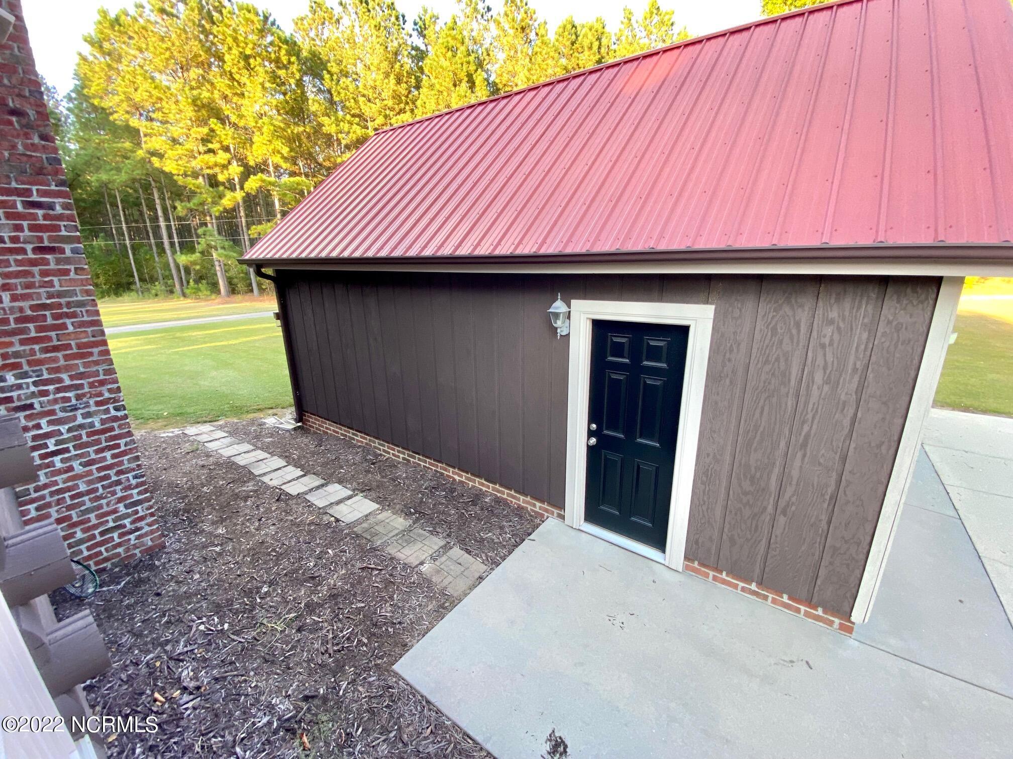 411 Rice Pond Road Elizabethtown, NC 28337 - Photo 49 of 54 With Garage Door and Side Entry Door