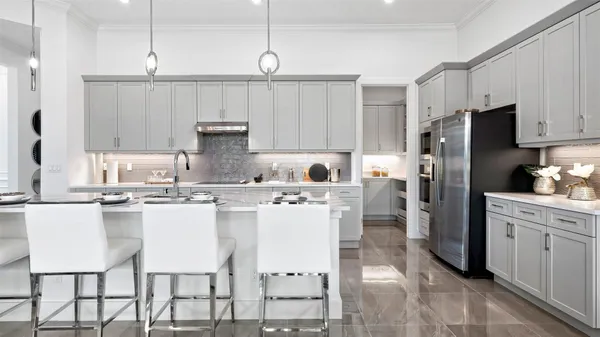 a kitchen with kitchen island a appliances cabinets and a counter top space