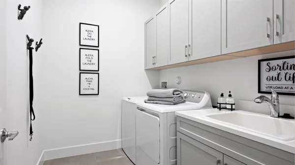 a bathroom with a sink and cabinets