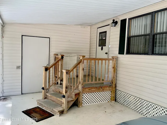 a kitchen with stainless steel appliances granite countertop a refrigerator a stove and a sink