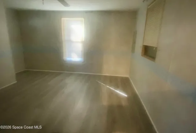 an empty room with windows