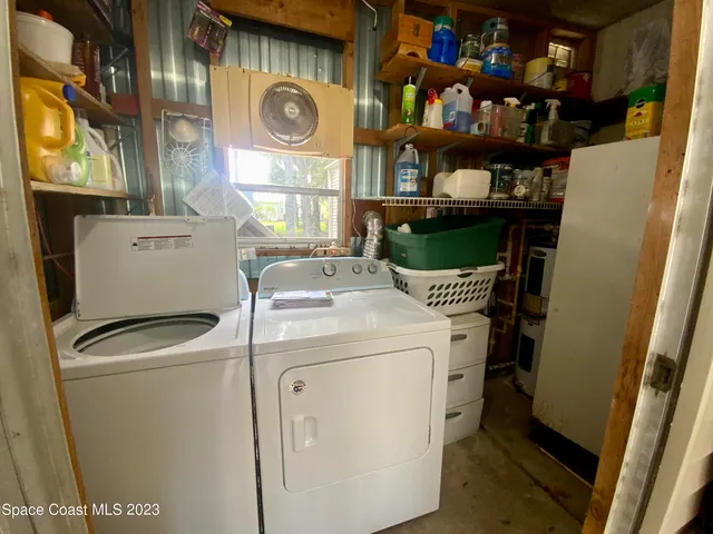 a swimming pool view with a outdoor seating