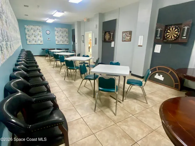 a view of a swimming pool with outdoor seating