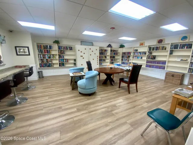 a view of a sign board with a wooden fence