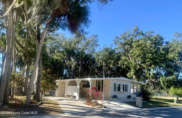 a view of house with outdoor space and garden