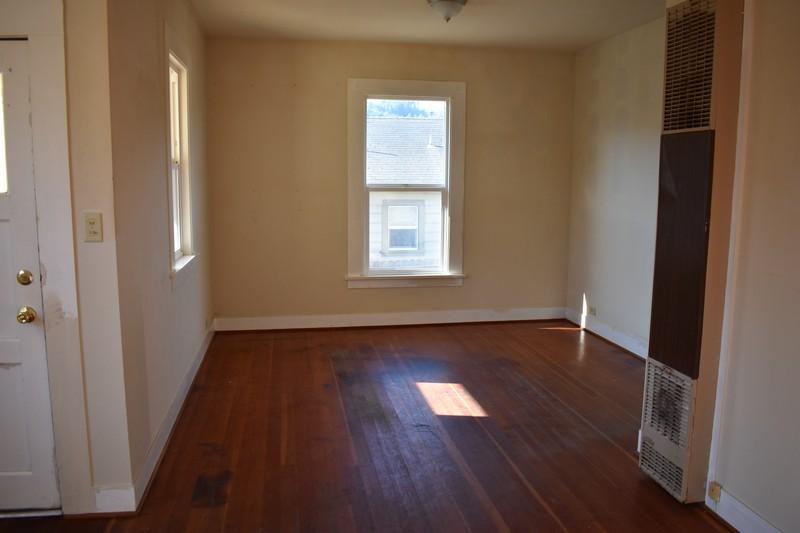 648 3rd Street Scotia, CA 95565 - Photo 3 of 10 front room and wall heater