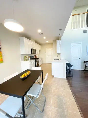 a view of kitchen with cabinets and wooden floor