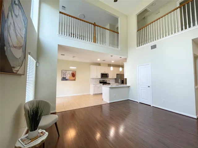 a view of kitchen with cabinets and wooden floor