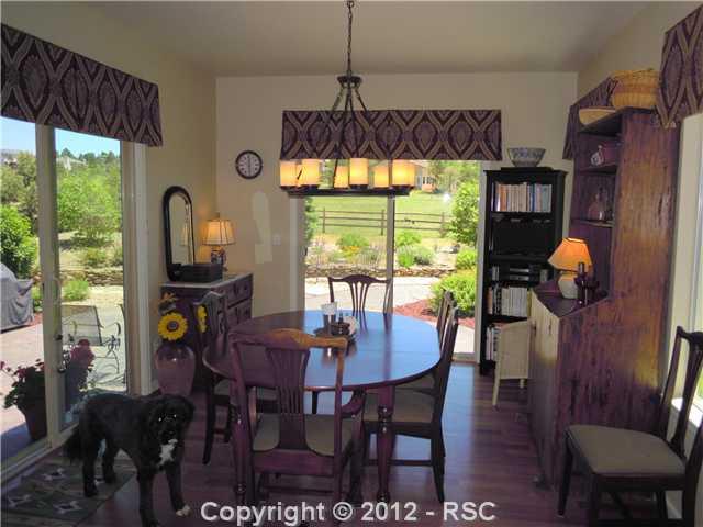 1075 Bowstring Road Monument, CO 80132 - Photo 4 of 16 Two sliding doors invite you for breakfast on the sunny Colorado mornings! Dezi would join you!