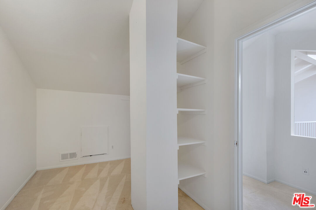 4451 Don Ricardo Drive, Unit 9 Los Angeles, CA 90008 - Photo 19 of 23 a view of an empty walk in closet