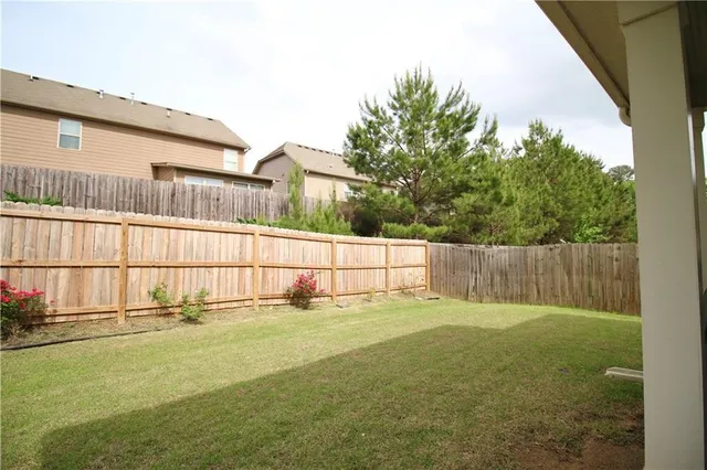 a backyard of a house with lots of green space