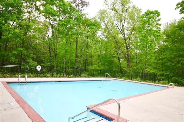 a view of a pool with a yard