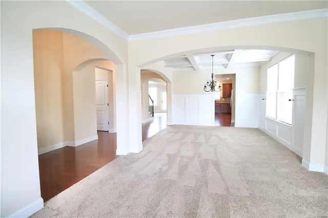 a view of a big room with closet and wooden floor