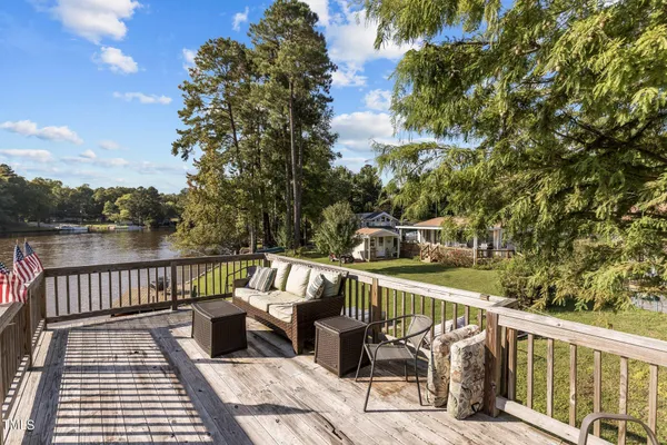 a view of a roof deck with couches and city view