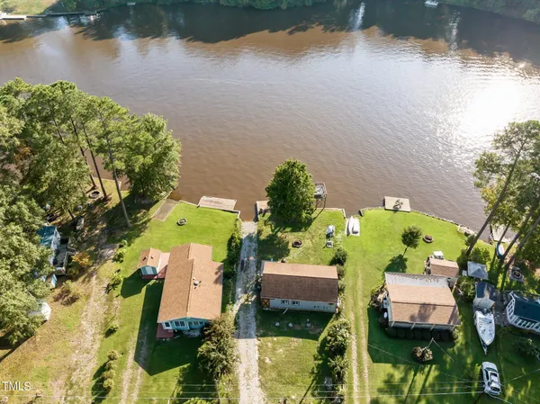 an aerial view of houses with yard