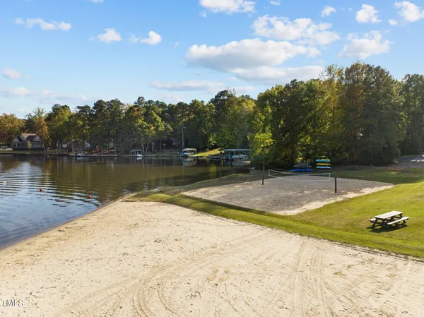 a view of a swimming pool with an outdoor space and seating area