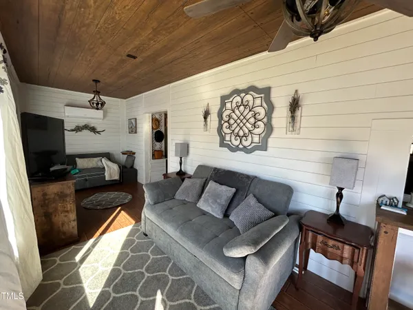 a living room with furniture and a rug