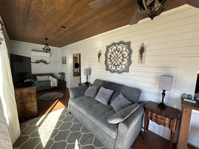 a living room with furniture and a rug