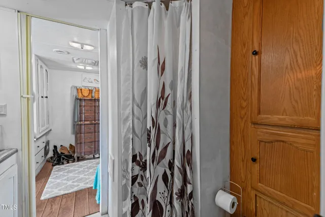 a view of a livingroom and a bathroom