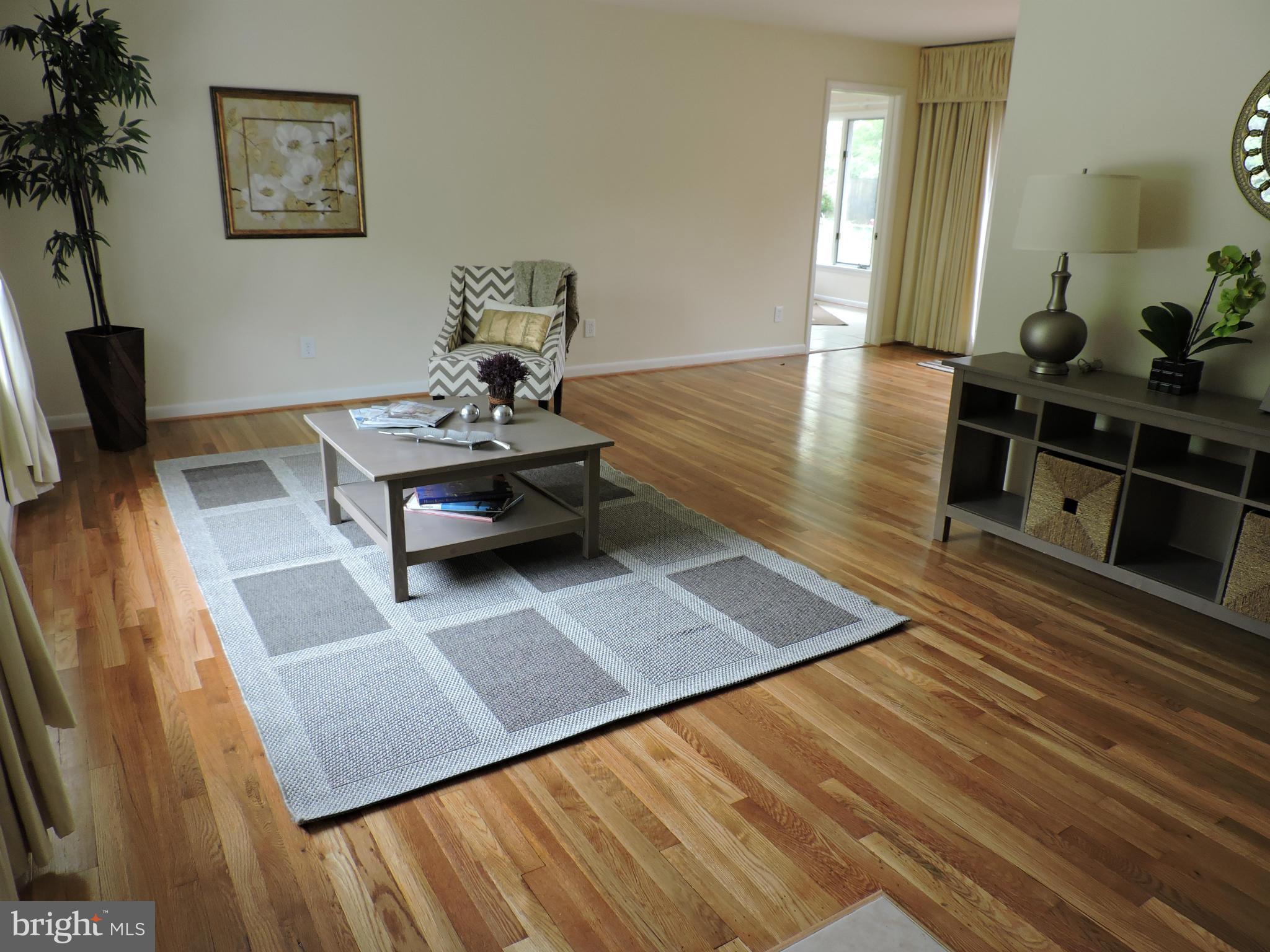 5011 Roslyn Road Annandale, VA 22003 - Photo 12 of 28 a living room with furniture rug and wooden floor