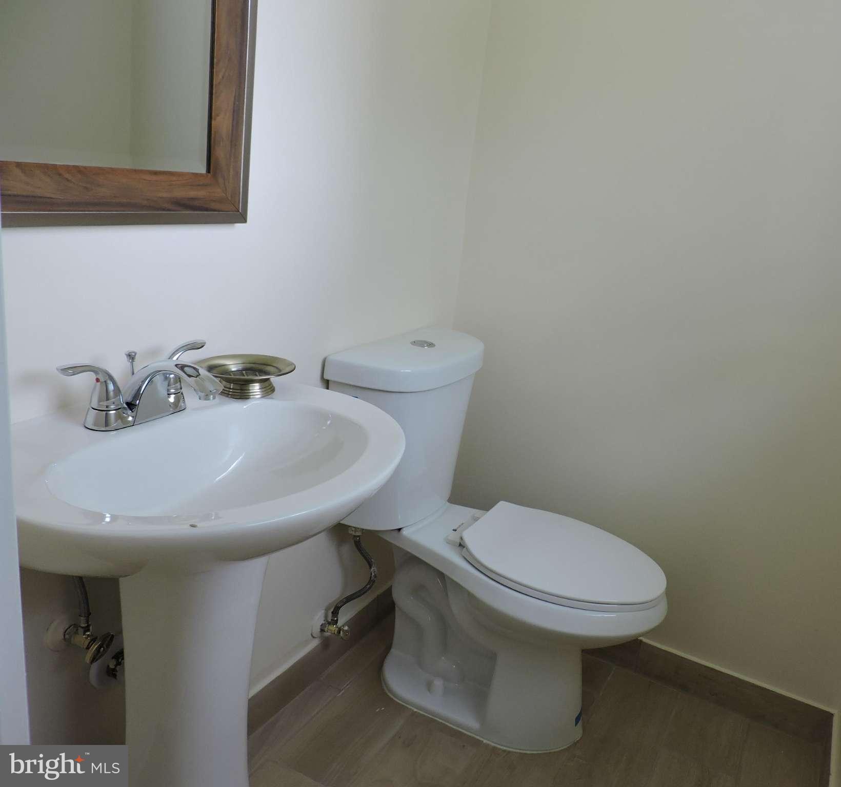5011 Roslyn Road Annandale, VA 22003 - Photo 25 of 28 a bathroom with a sink and a toilet