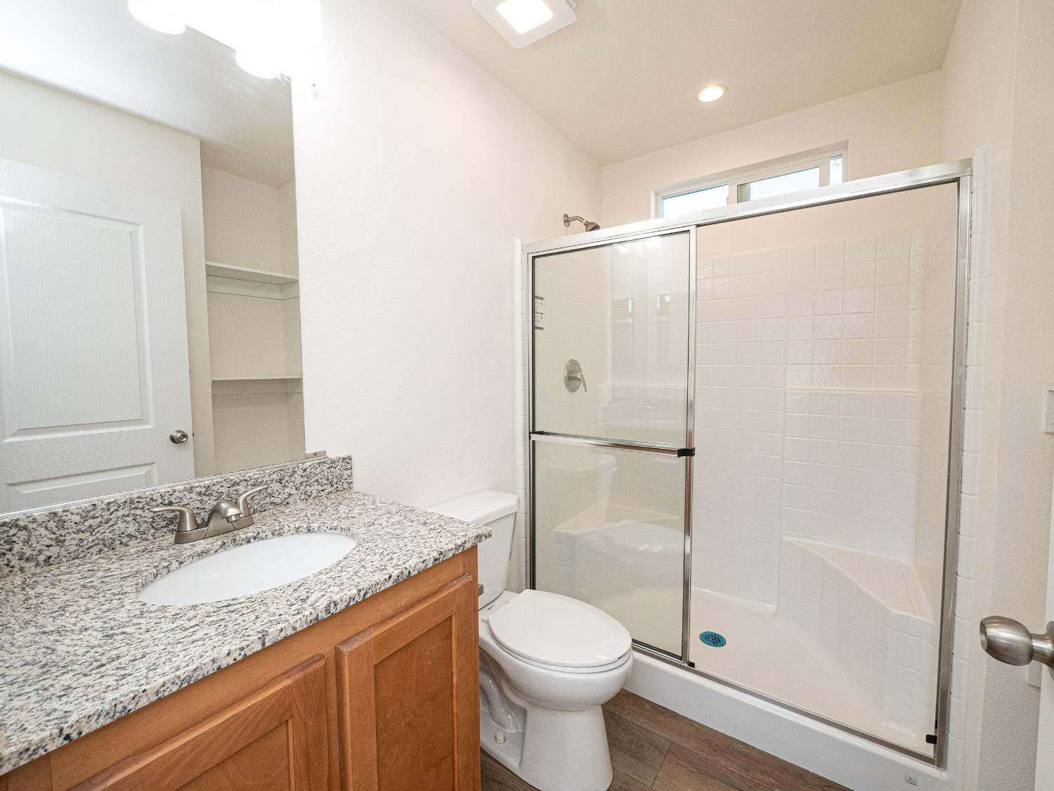 6540 Virginiatown Road, Unit 30 Newcastle, CA 95658 - Photo 11 of 24 a bathroom with a granite countertop sink toilet and shower