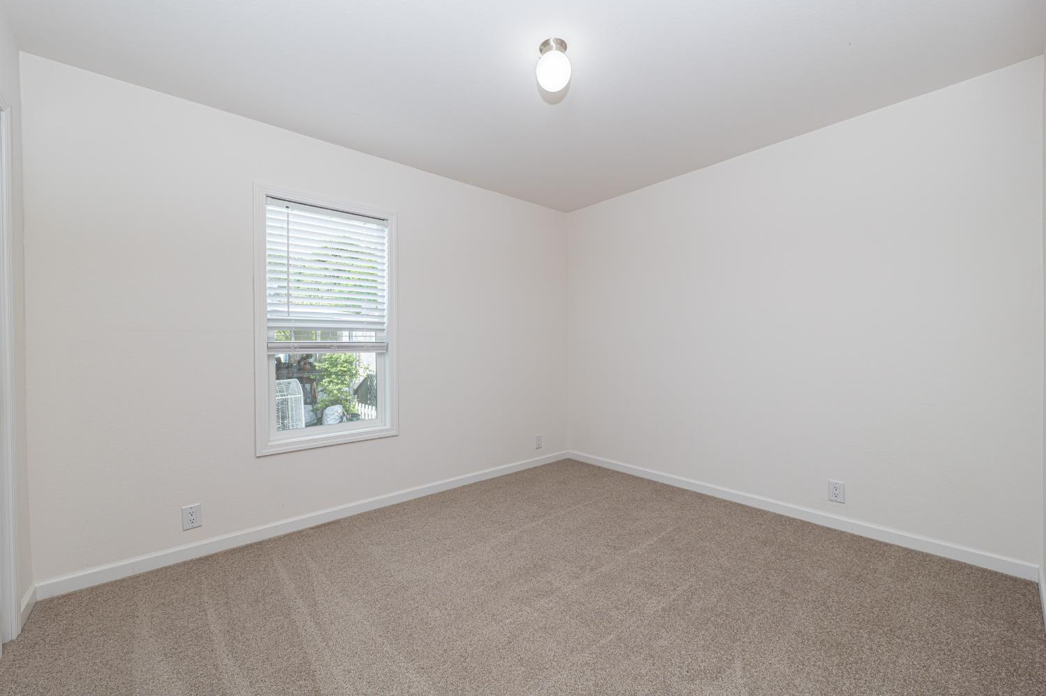 6540 Virginiatown Road, Unit 30 Newcastle, CA 95658 - Photo 12 of 24 an empty room with a window