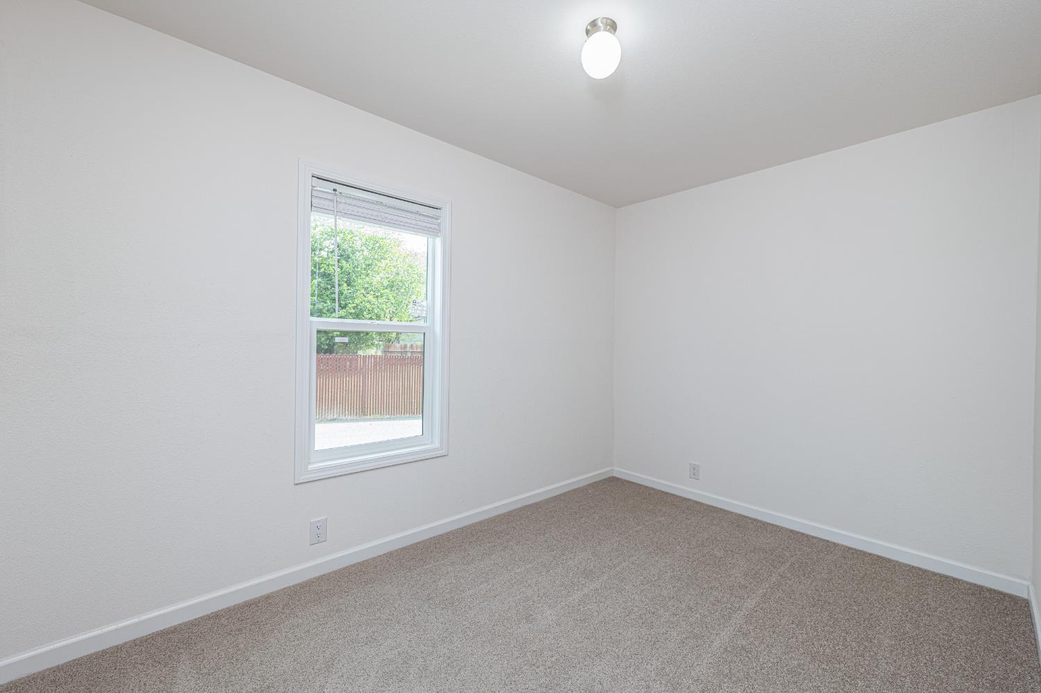 6540 Virginiatown Road, Unit 30 Newcastle, CA 95658 - Photo 14 of 24 an empty room with a window