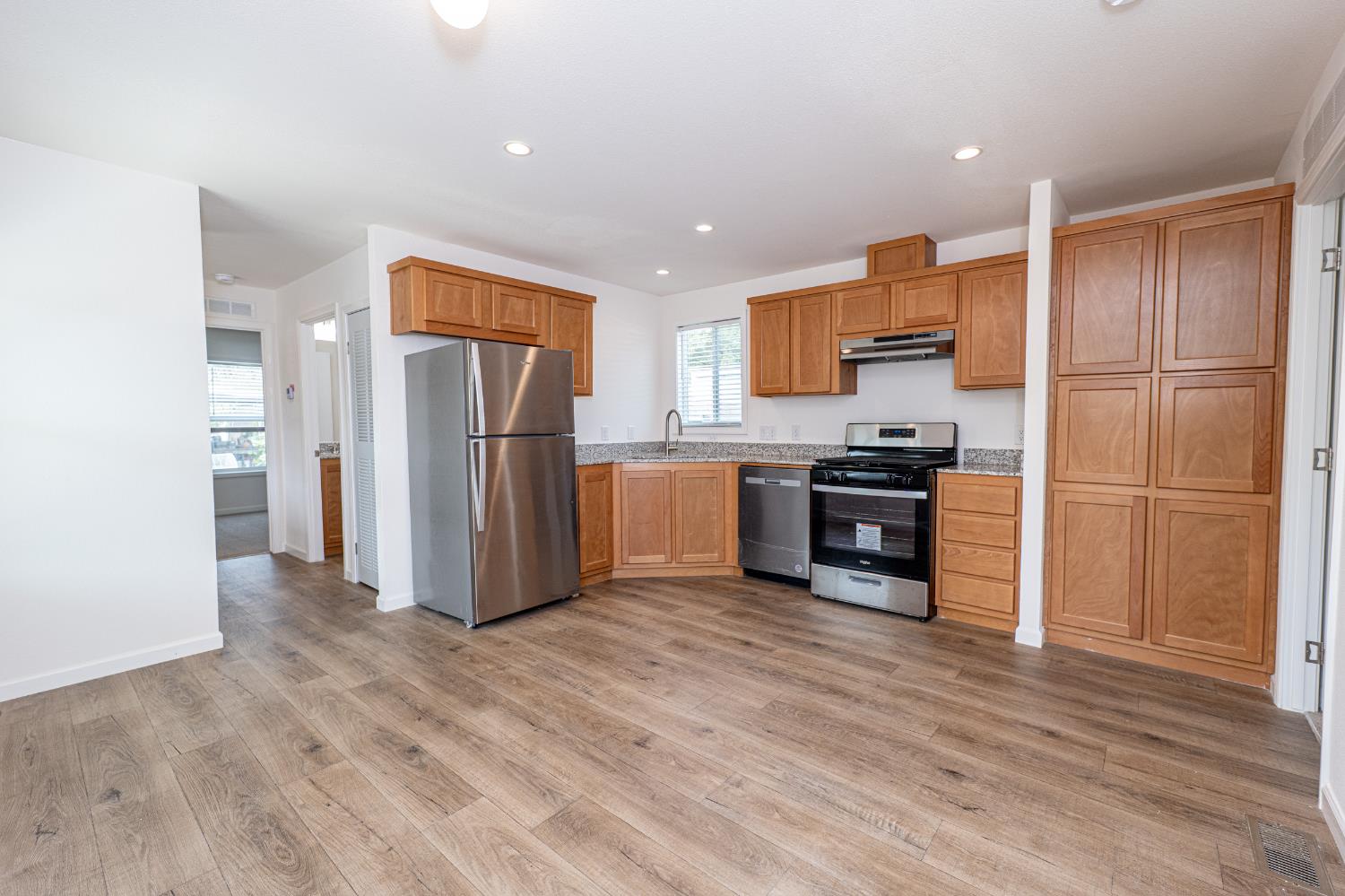 6540 Virginiatown Road, Unit 30 Newcastle, CA 95658 - Photo 5 of 24 a kitchen with stainless steel appliances a refrigerator and a stove top oven