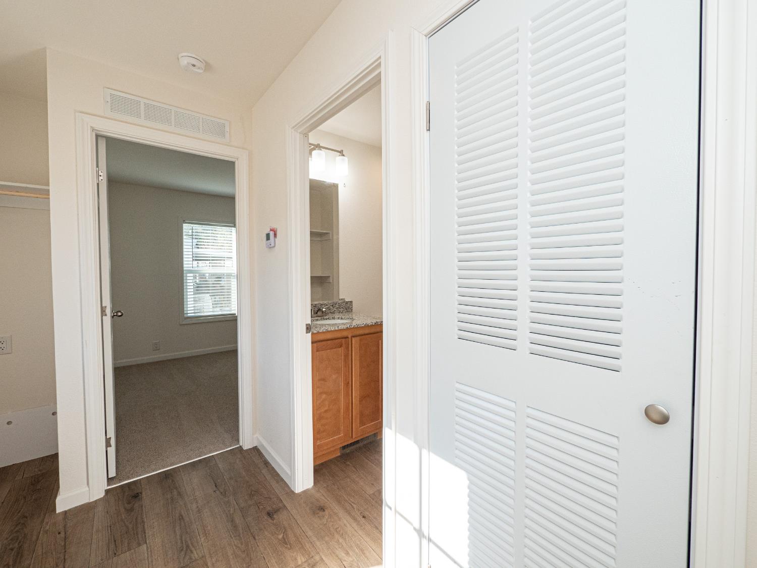 6540 Virginiatown Road, Unit 30 Newcastle, CA 95658 - Photo 8 of 24 a view of a hallway with wooden floor