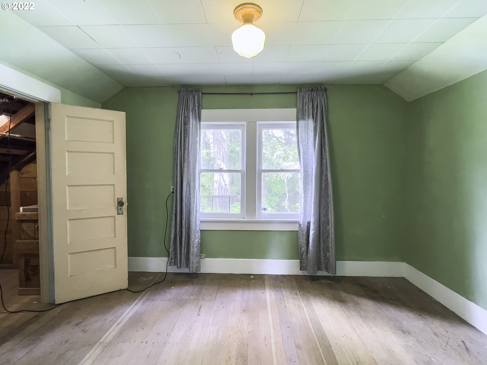 54647 Southwest Patton Valley Road Gaston, OR 97119 - Photo 15 of 29 an empty room with wooden floor and windows