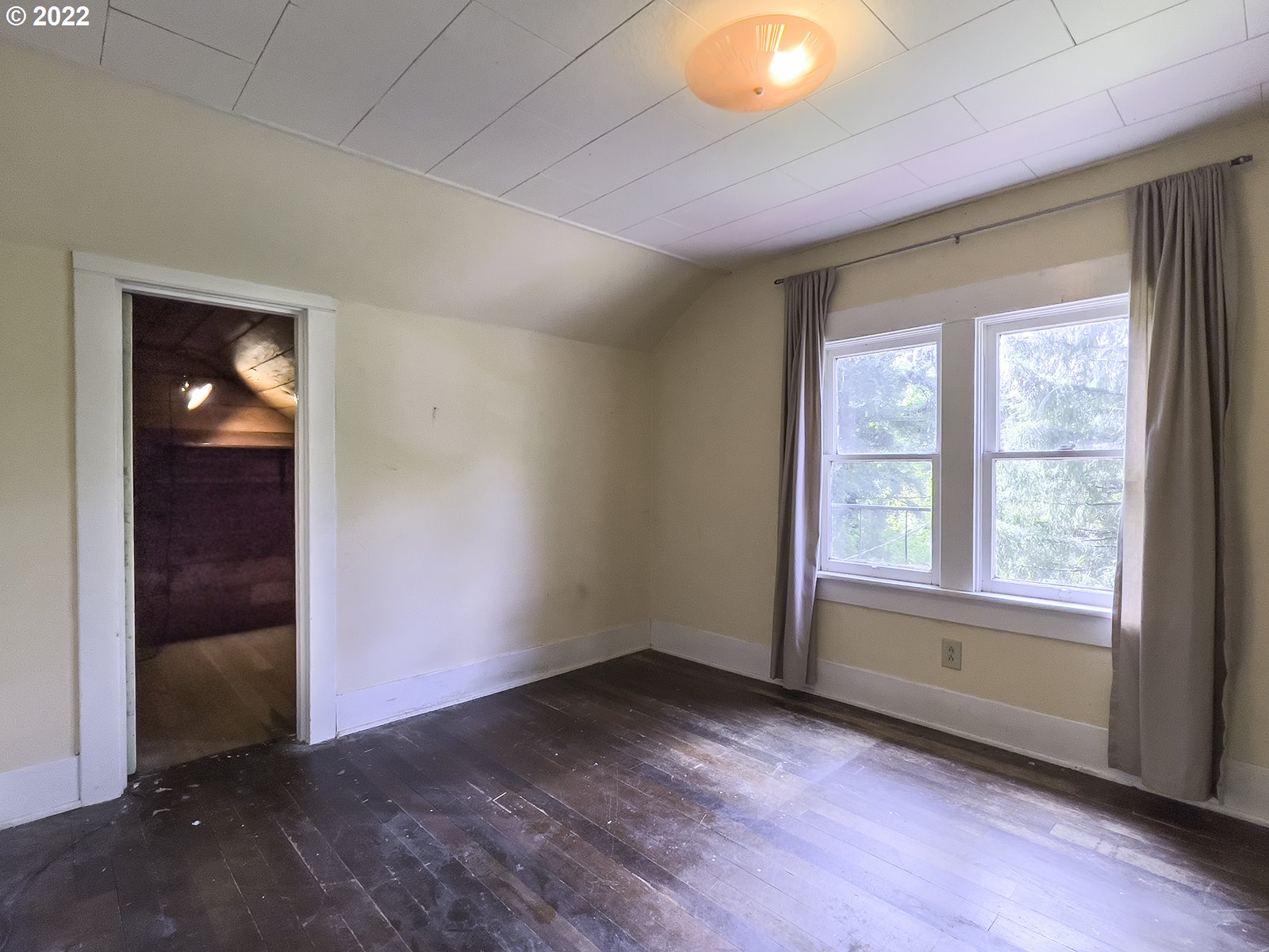 54647 Southwest Patton Valley Road Gaston, OR 97119 - Photo 16 of 29 an empty room with wooden floor and windows