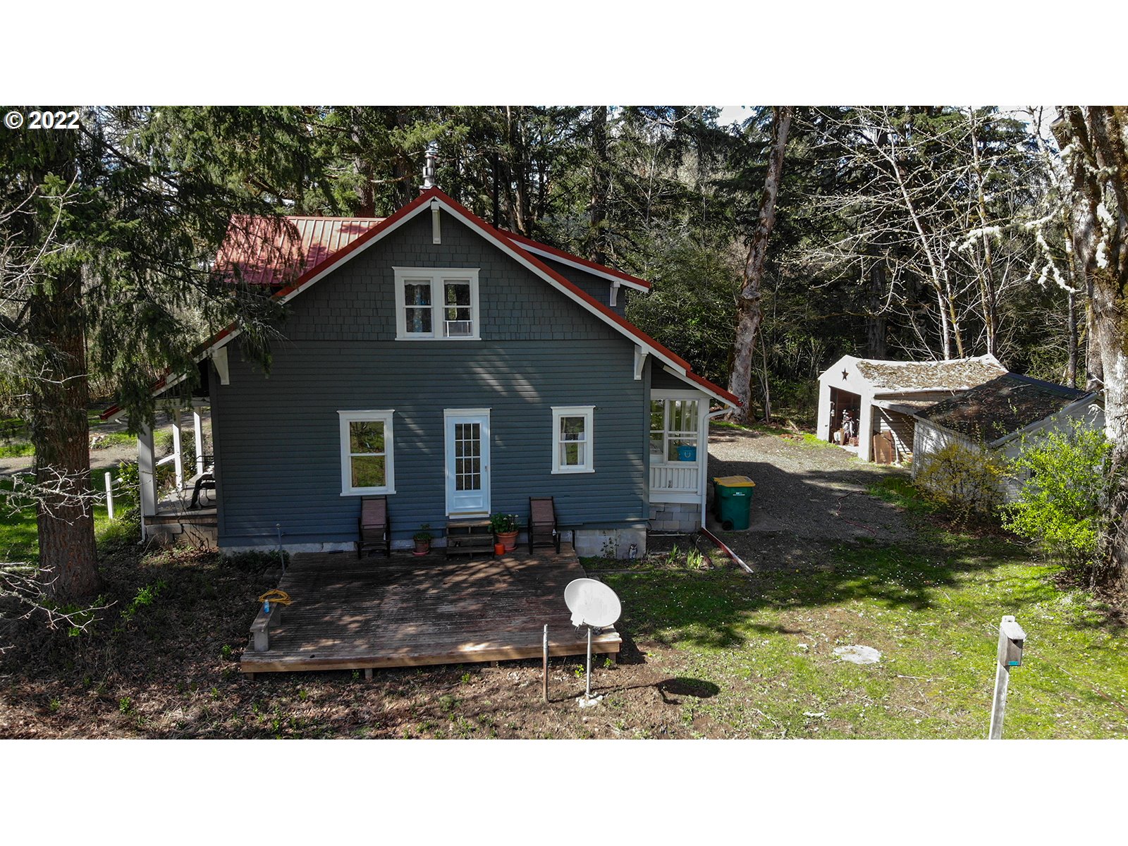 54647 Southwest Patton Valley Road Gaston, OR 97119 - Photo 2 of 29 a backyard of a house with a yard fire pit and outdoor seating