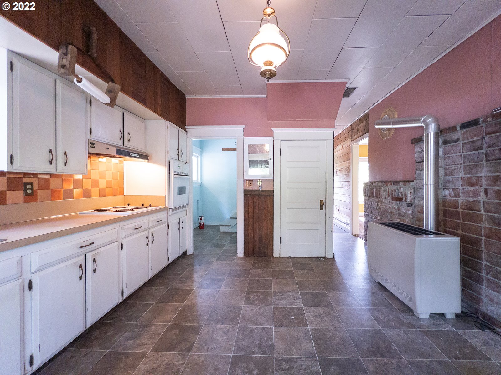 54647 Southwest Patton Valley Road Gaston, OR 97119 - Photo 7 of 29 a large kitchen with cabinets and stainless steel appliances