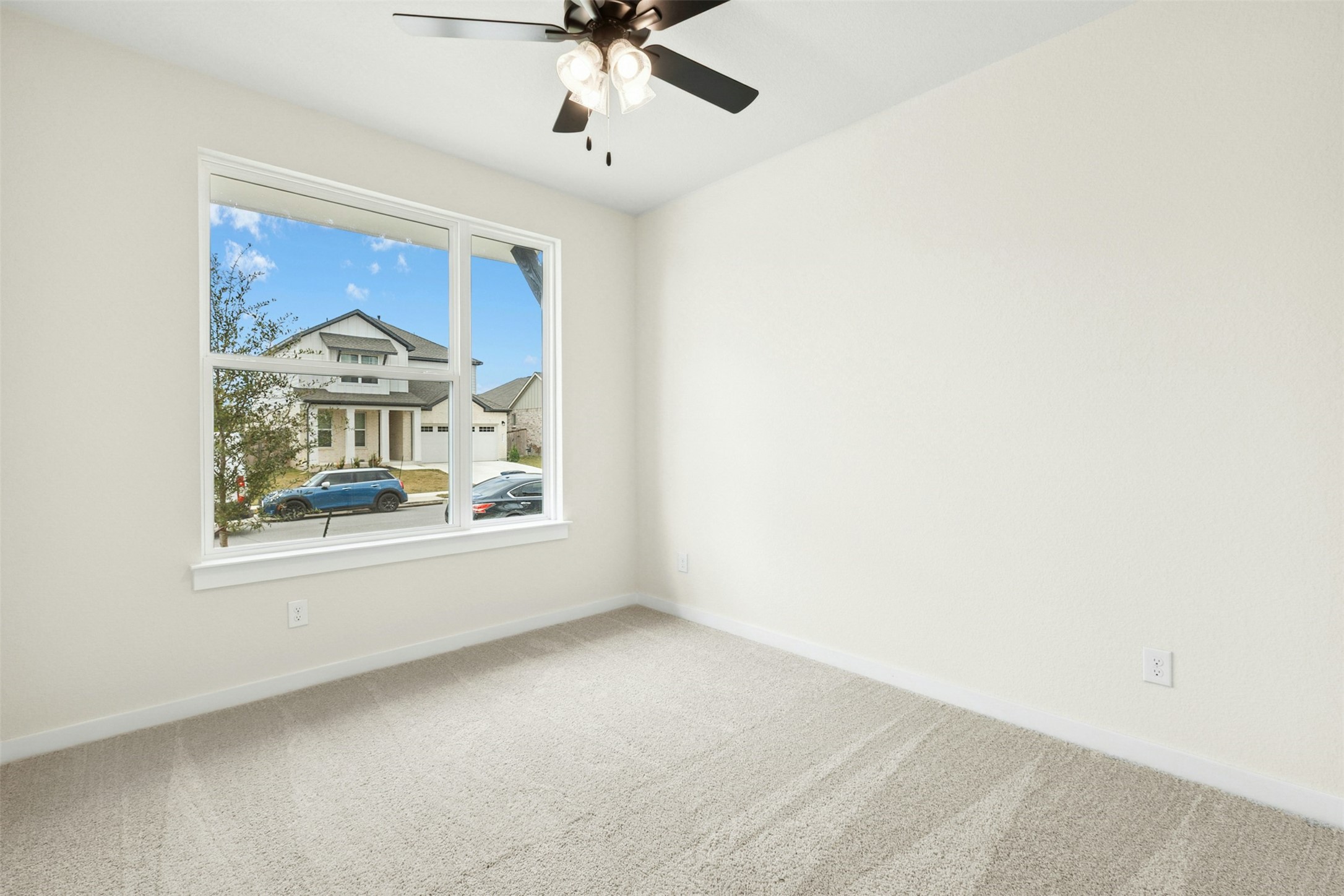 4313 Contrail Lane Round Rock, TX 78665 - Photo 12 of 32 an empty room with a window and a ceiling fan
